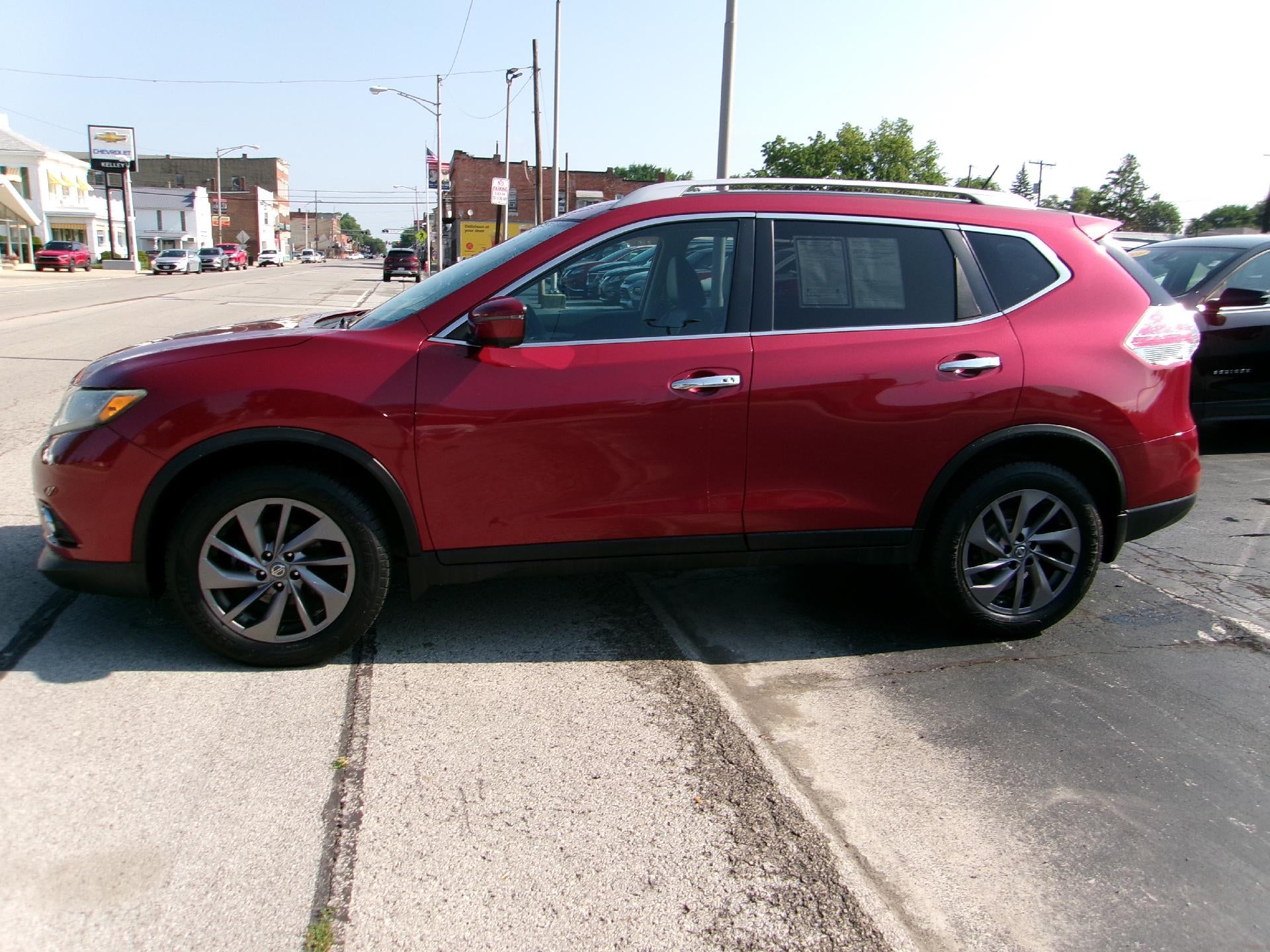 2016 Nissan Rogue SL in Red — front three-quarter view